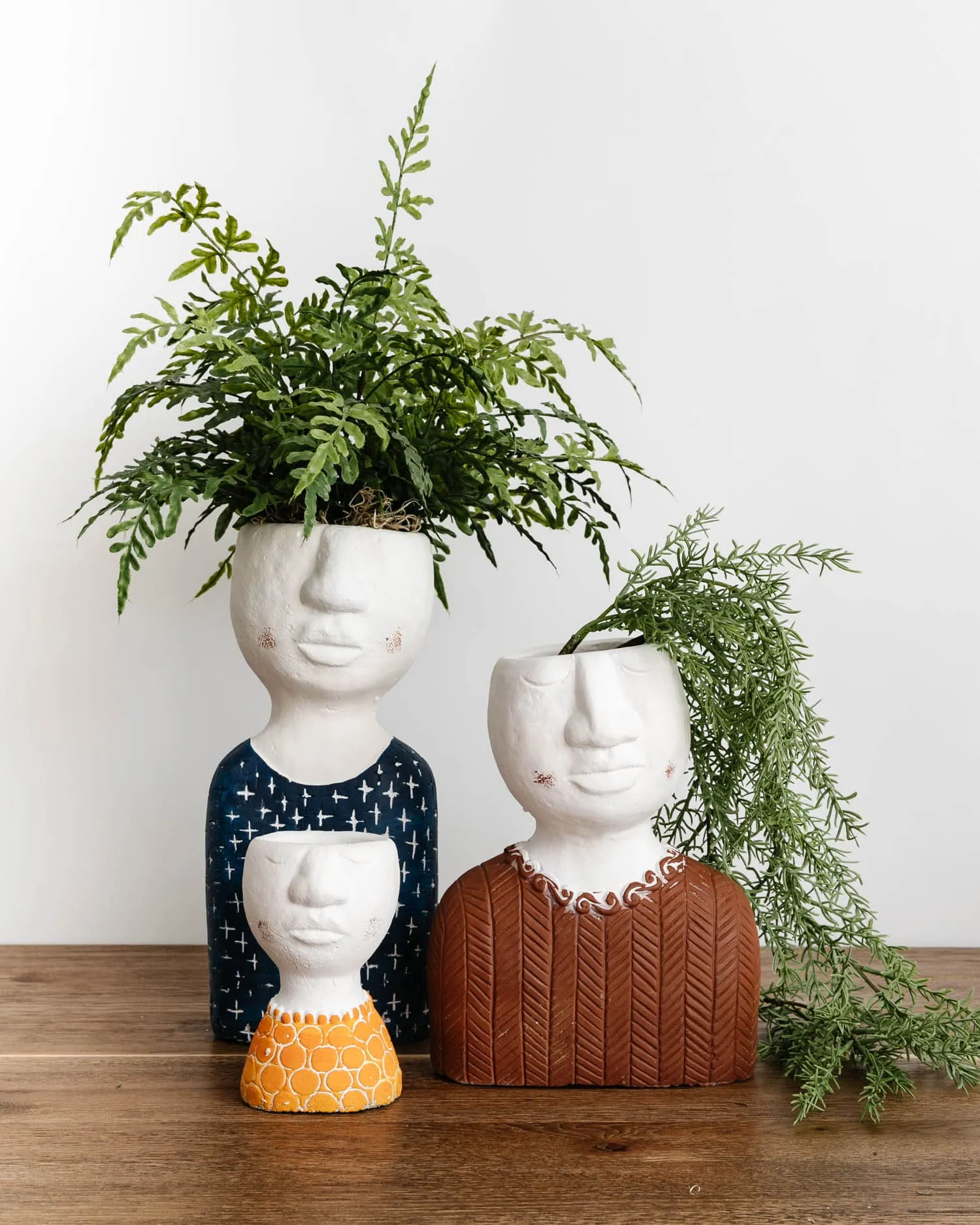 "Pot Head" Concrete Planters